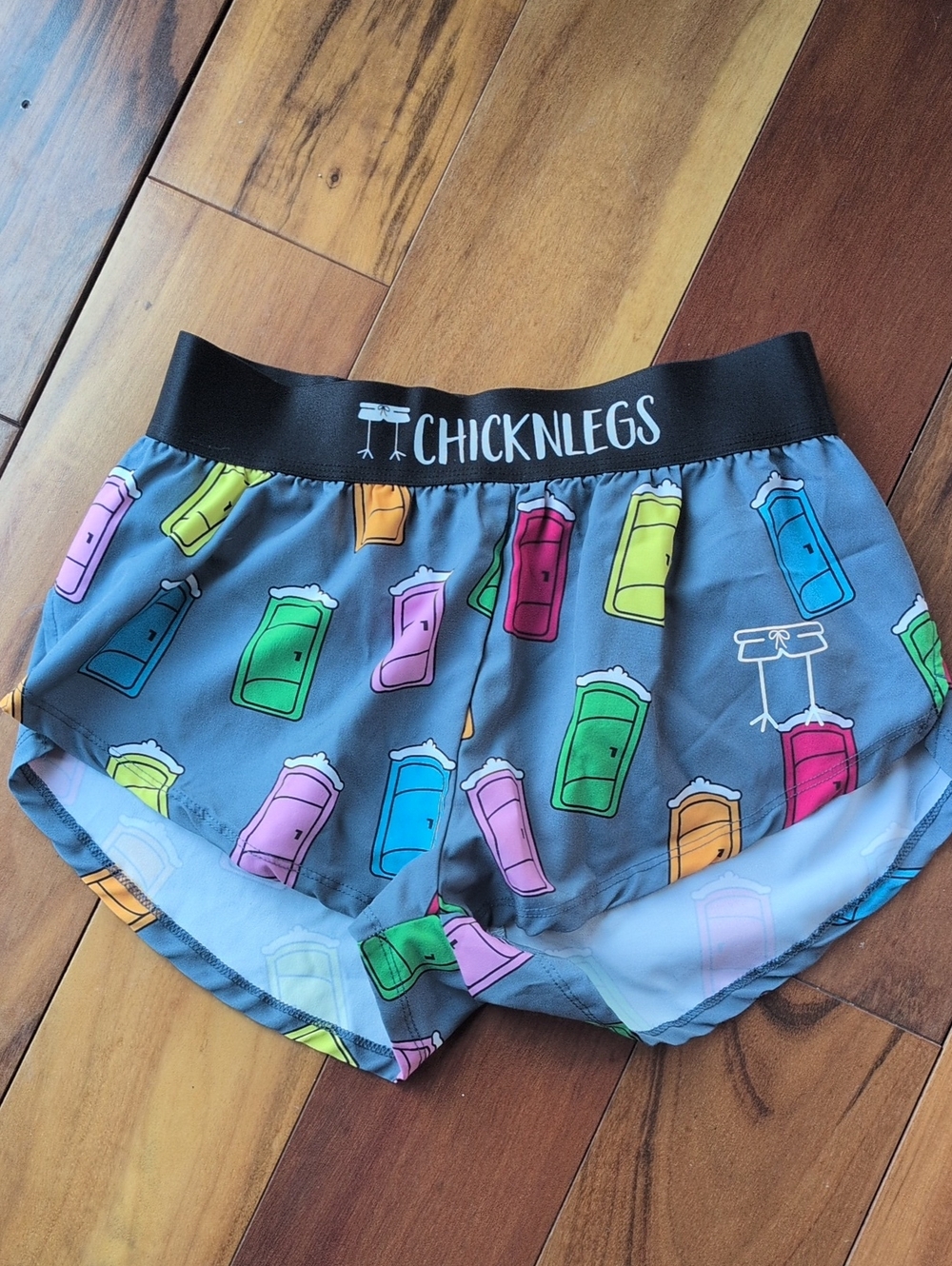 Chicknlegs Gray Athletic Shorts with Multi-Color Porta Potty Print